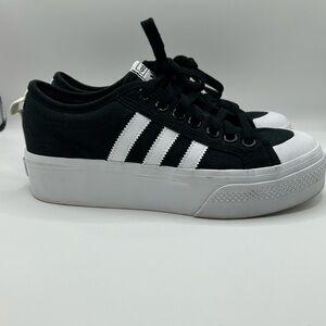 Adidas originals Nizza platform sneakers in black and white.